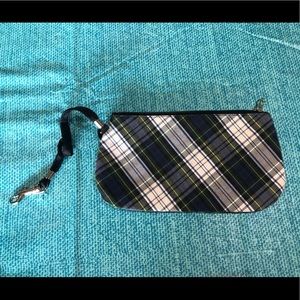 A small zip up purse, plaid